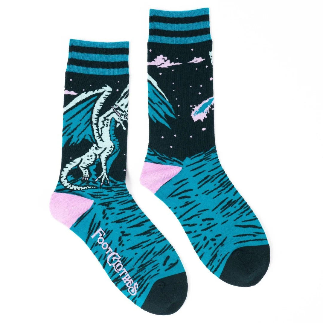 Two socks with dragon and space-themed designs on a white background