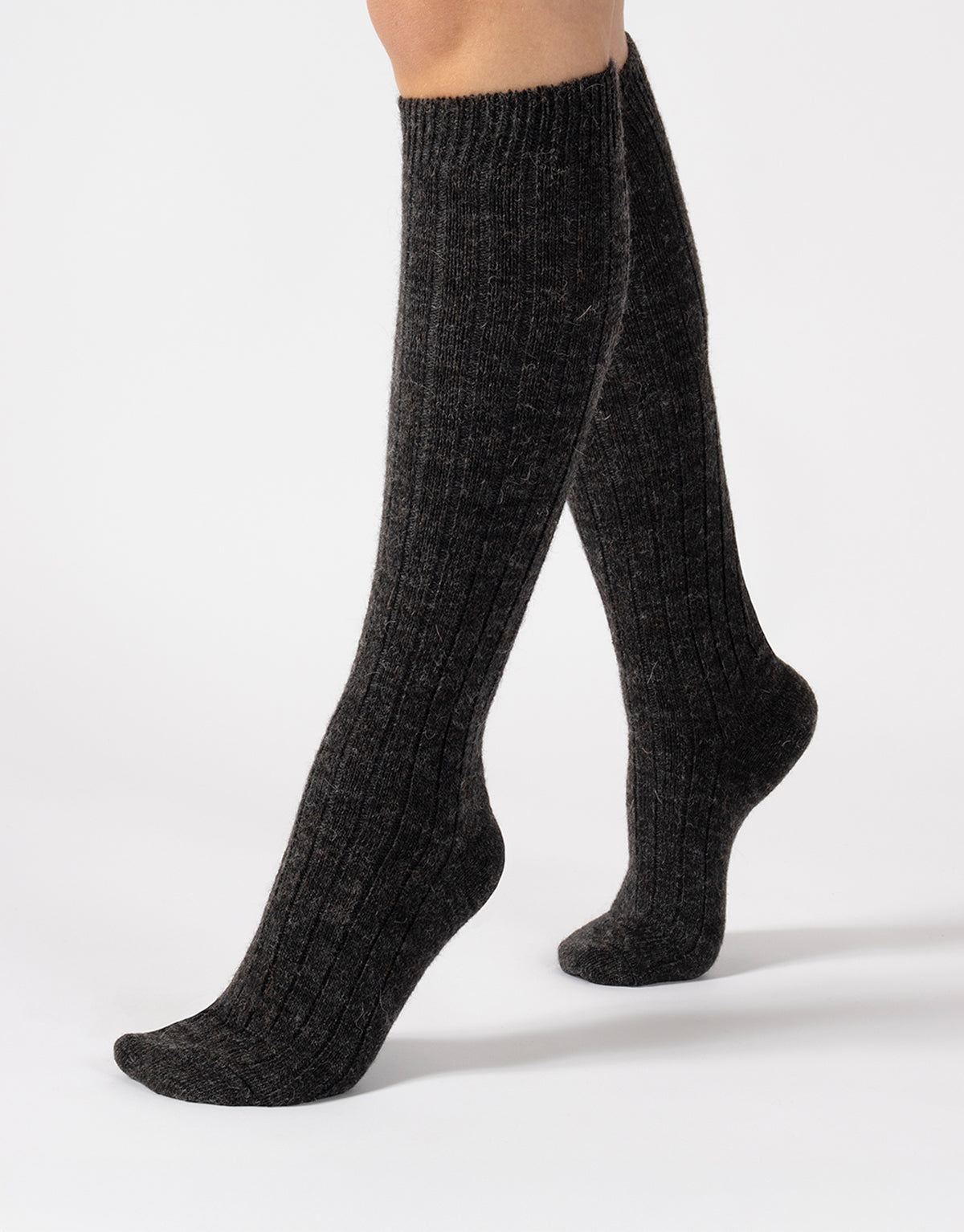 Dark gray knee-high socks on a white background