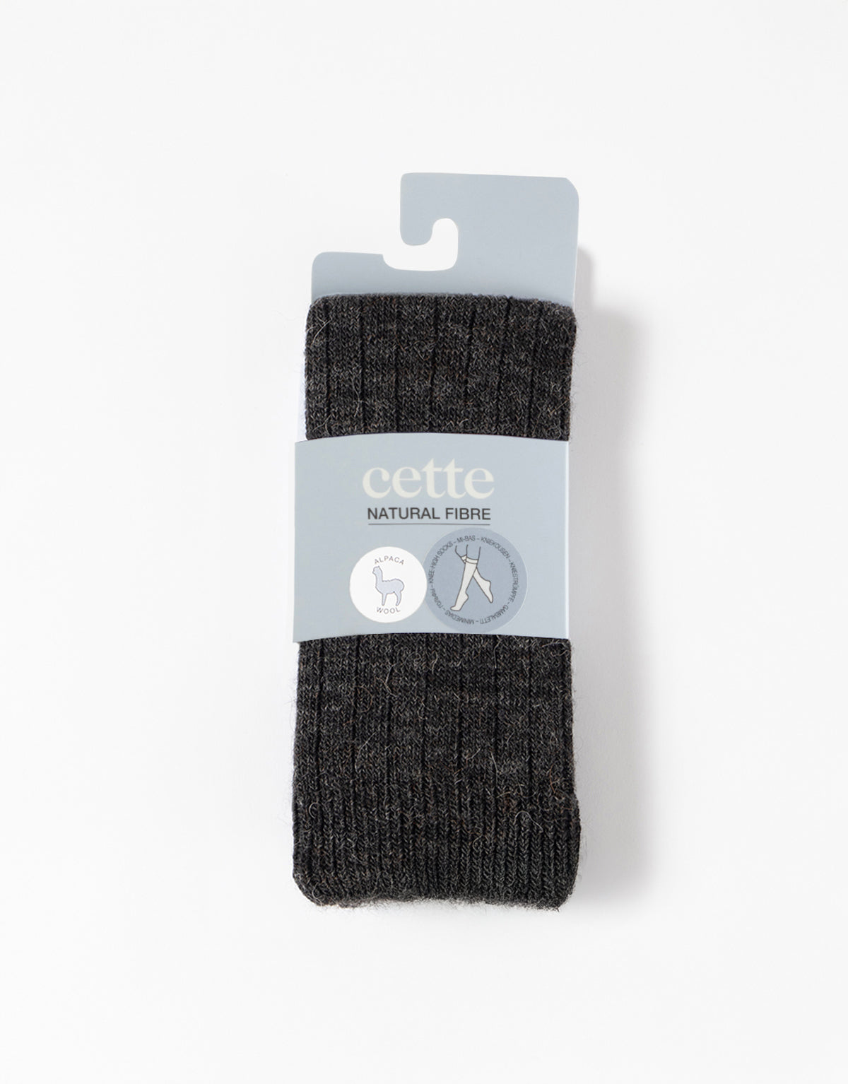 Black socks with a 'cette' label on a white background
