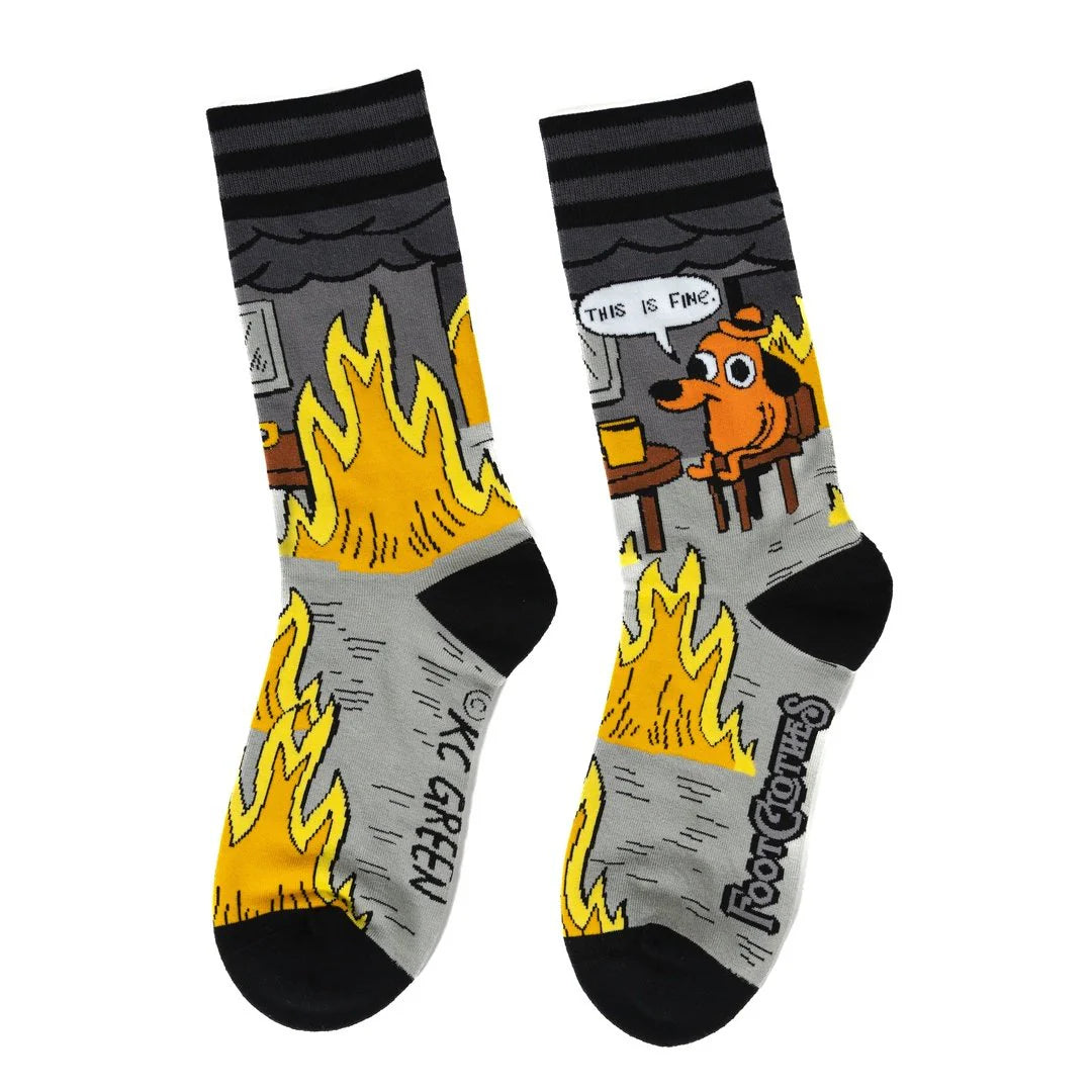 Two socks with cartoon design featuring flames and a dog, on a white background.