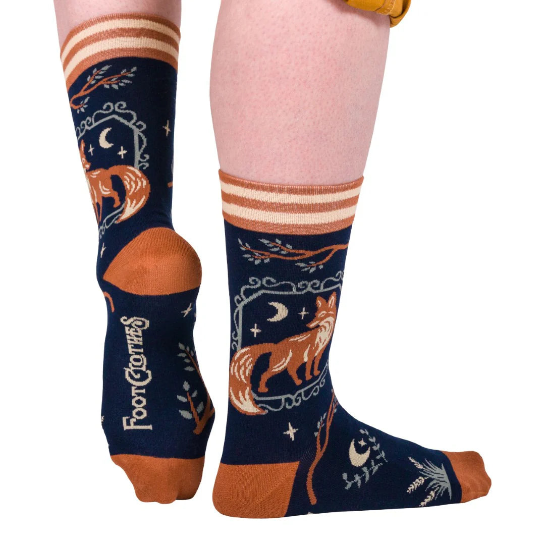 Navy blue socks with fox design and 'Four Corners' branding on a white background