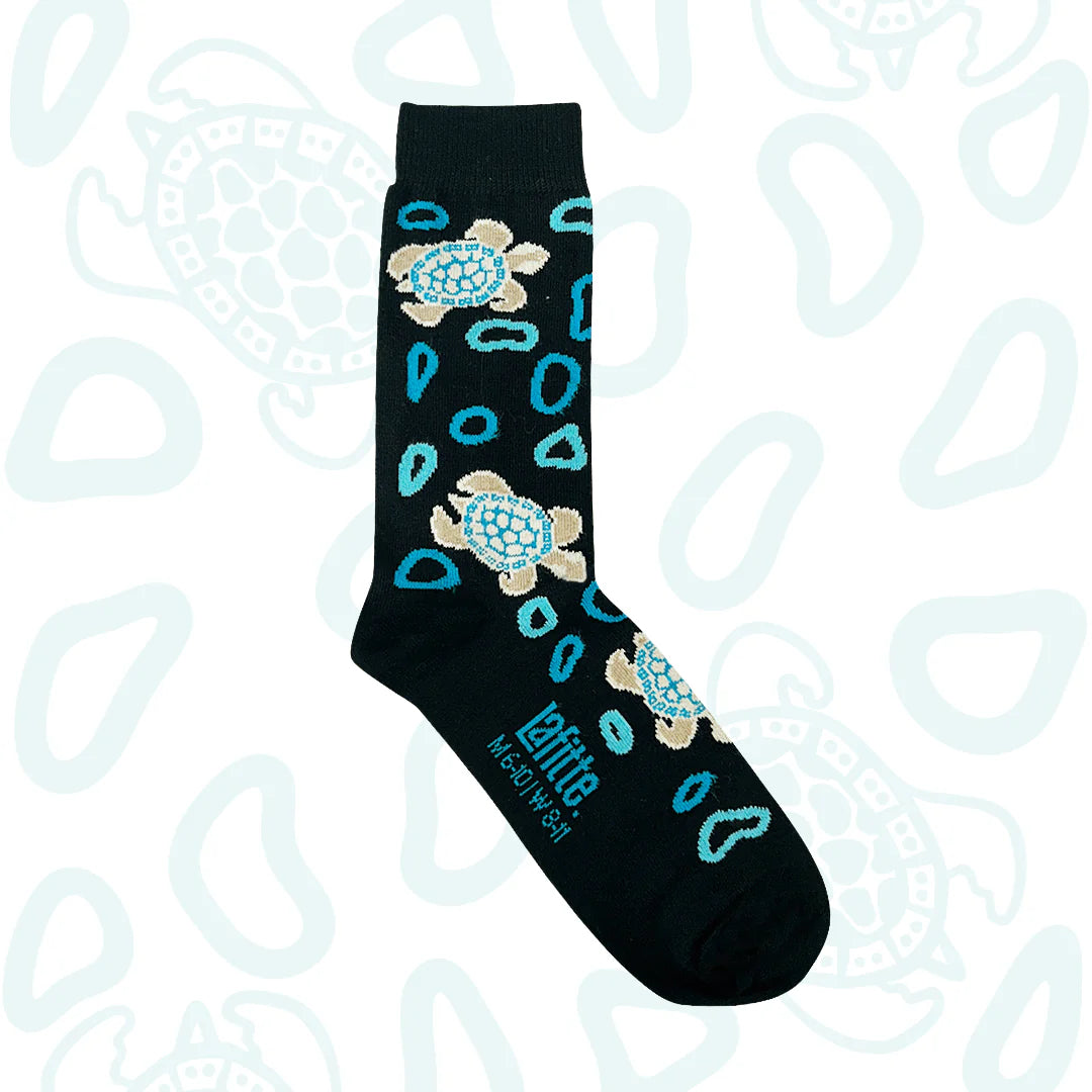 Black sock with turtle design on a light blue background