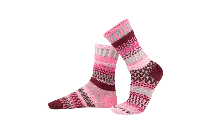 Pair of pink and purple patterned socks on a white background