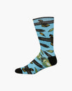 A single crew sock with a light blue background featuring a pattern of black birds, green leaves, and yellow accents, finished with solid black toes and heels, shown on a plain white background.