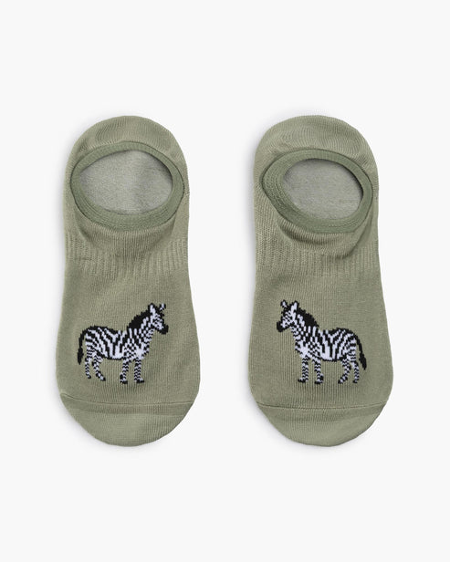 Two pairs of green socks with zebra designs on a white background