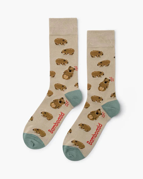 Pair of socks with animal pattern and 'Bambood' branding on a beige background