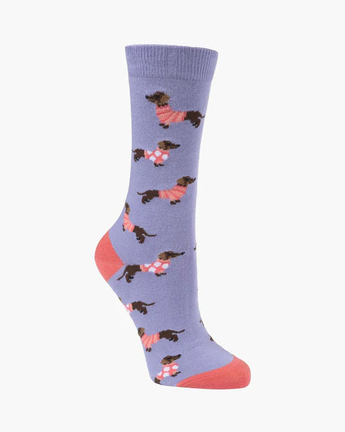 Purple sock with dog pattern on a white background