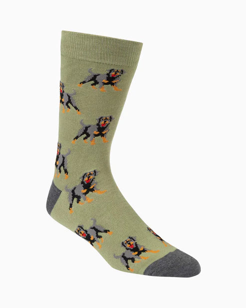 Green sock with Rottweiler dog pattern on a white background