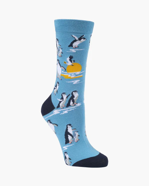 Blue sock with penguin design on a white background