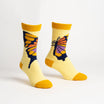 Pair of yellow socks with butterfly design on a light gray background