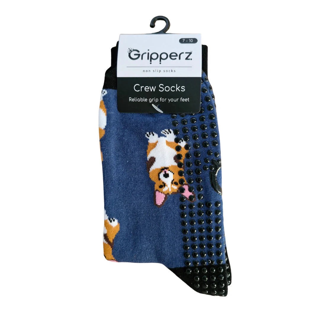 Pair of blue crew socks with dog pattern and black sole on a white background, featuring 'Gripperz' brand.