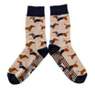 Pair of socks with dachshund pattern on a beige background