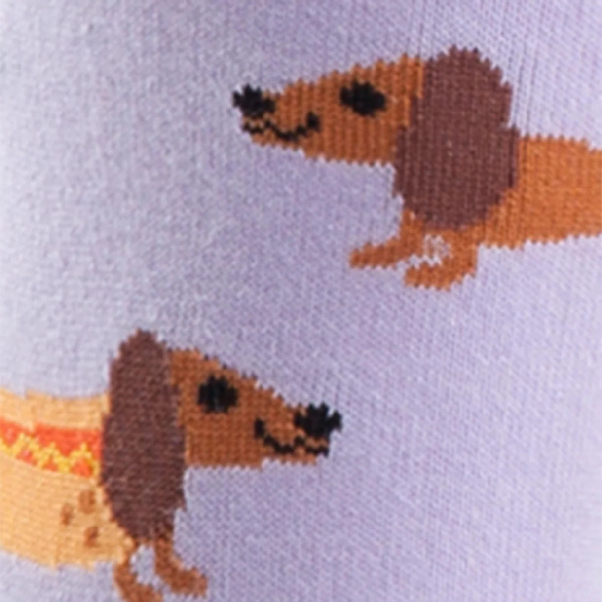 lilac coloured womens novelty crew sock with sausage dogs some in a hot dog bun, heel and toe yellow