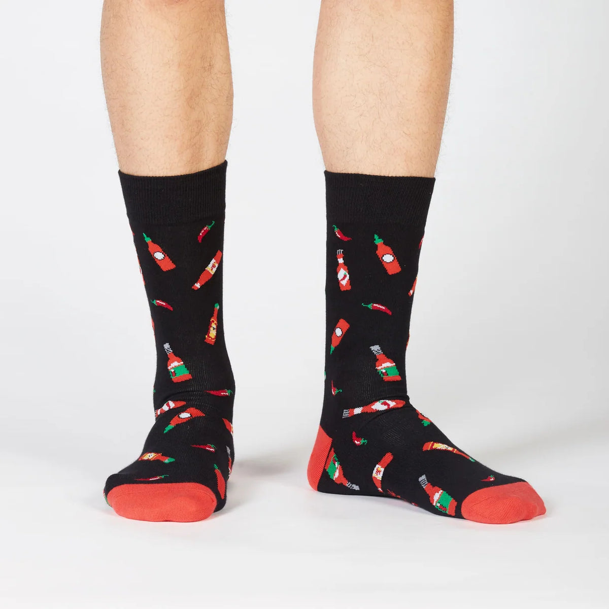 Black socks with hot sauce bottles
