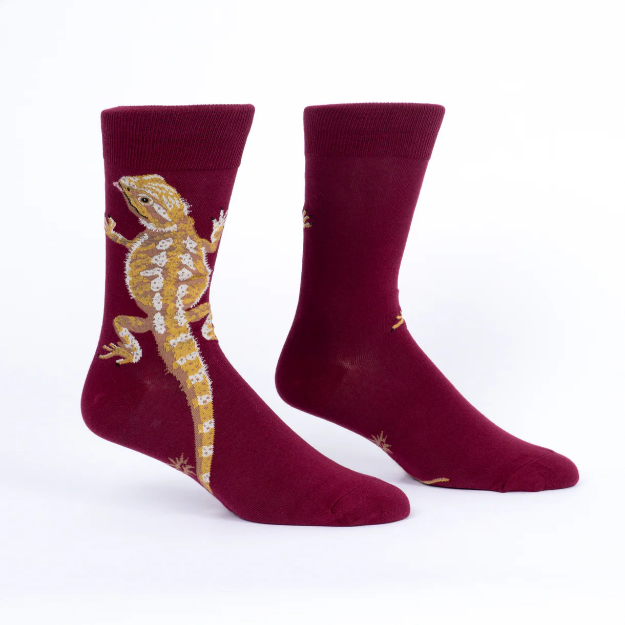Maroon socks with a lizard design on a white background