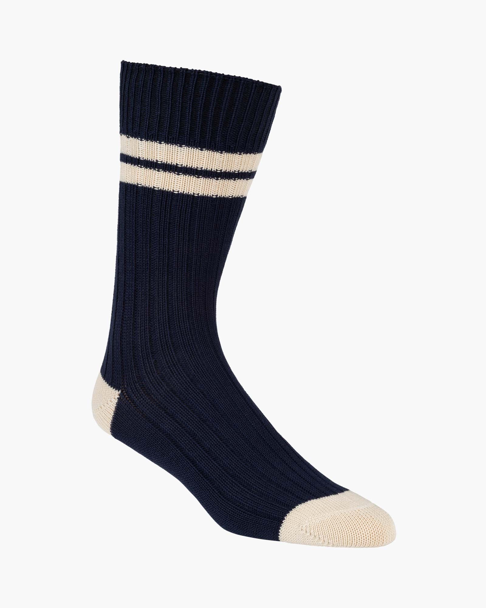 Navy sock with a white stripe on a white background