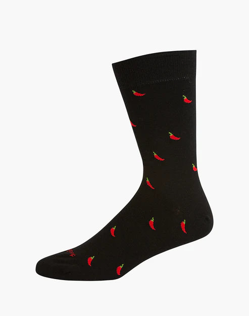 Black sock with red chili pepper pattern on a white background