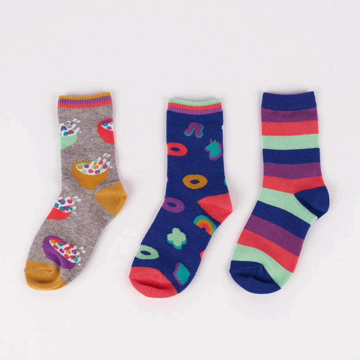 Three pairs of colorful socks on a white background