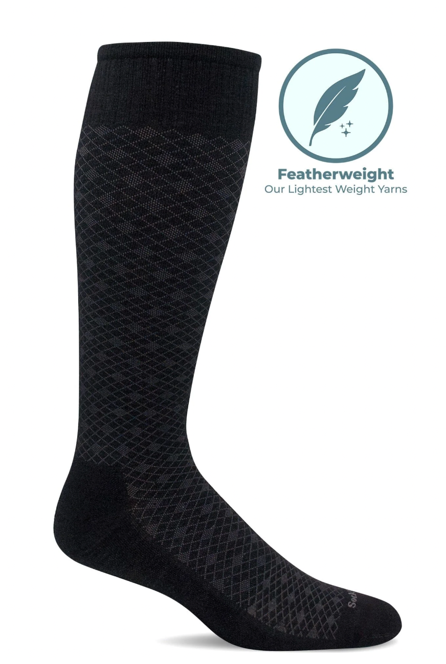 Black sock with textured pattern on a white background, featuring a featherweight yarn label.