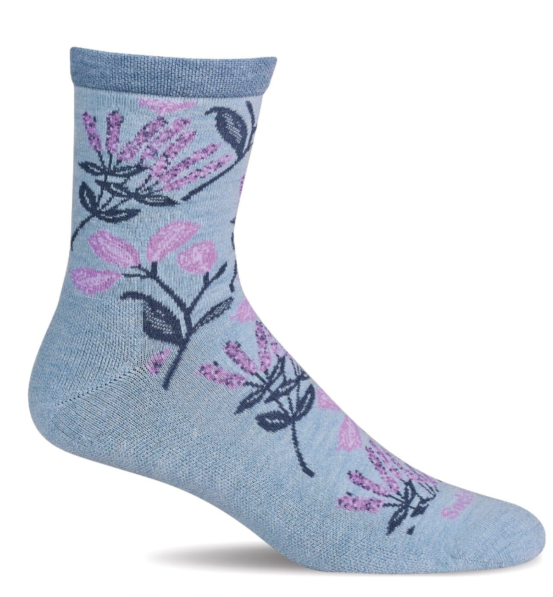 Blue sock with lavender flower pattern on a white background