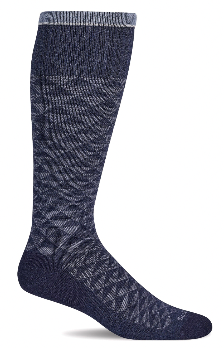 Navy blue knee-high sock with geometric pattern on a white background