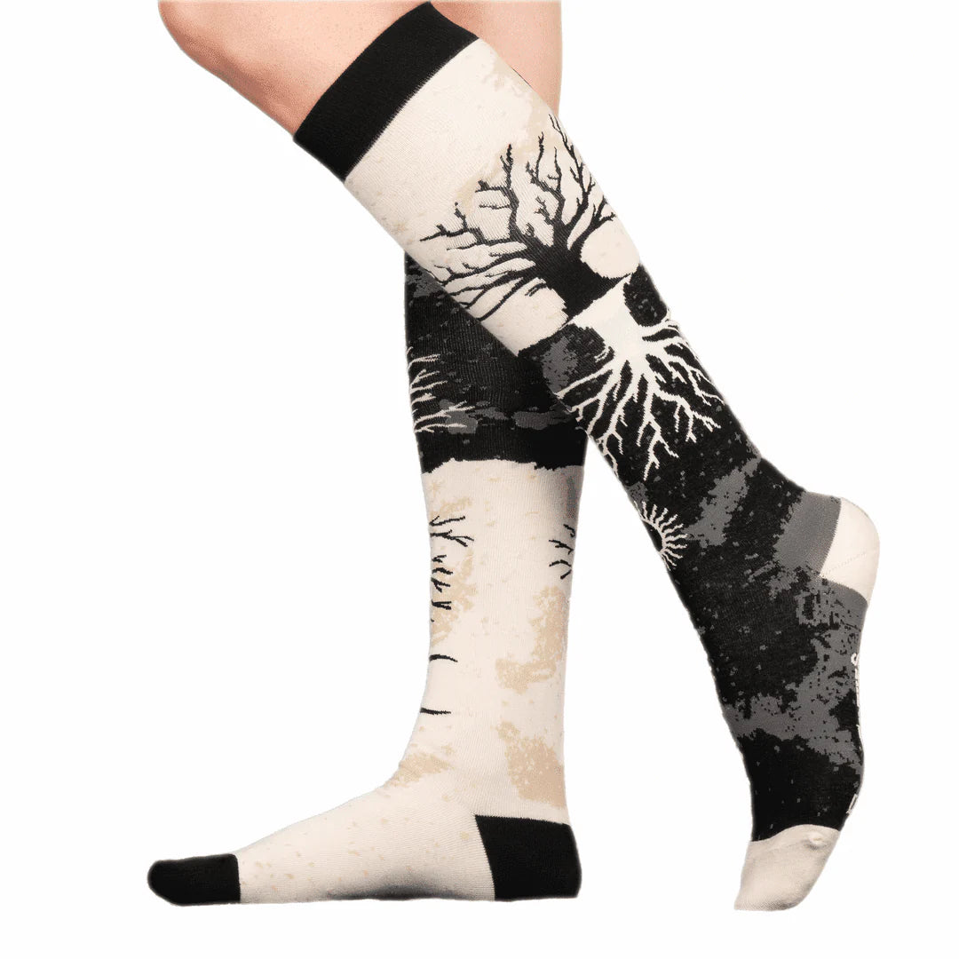 Knee-high socks with tree design on a white background