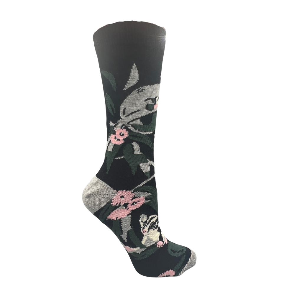 socks with possum and floral design on a black background