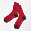 Pair of red socks with brown toes and heels on a white background
