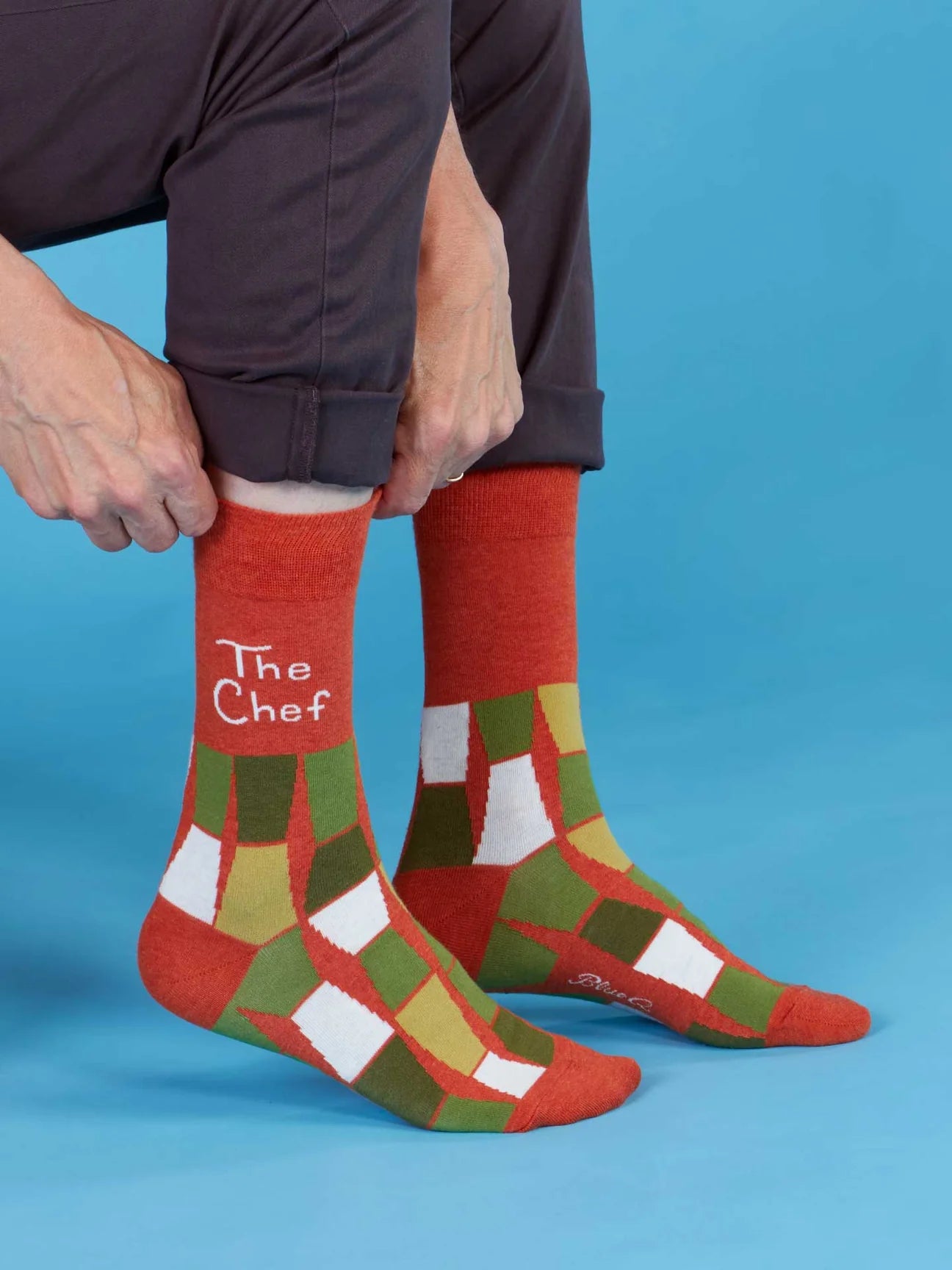Red patterned socks with 'The Chef' text on a blue background