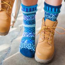 person wearing blue recycled fibres socks