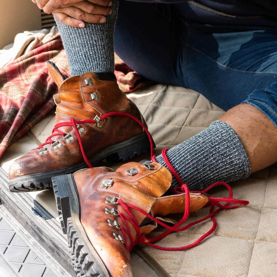 Person wearing brown hiking boots and extra wide merino socks - The Sockery