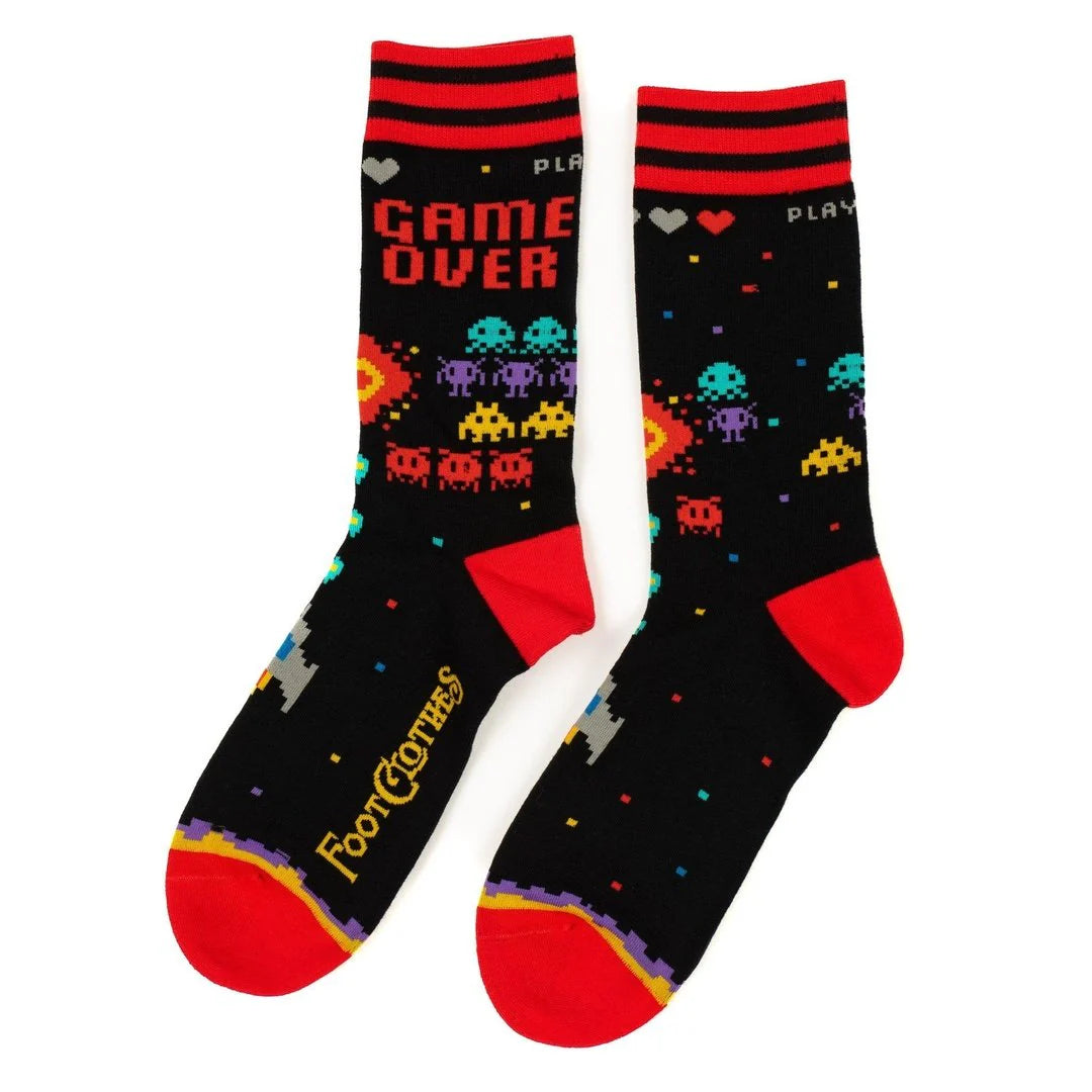 Pair of socks with retro game design and 'Game Over' text on a white background