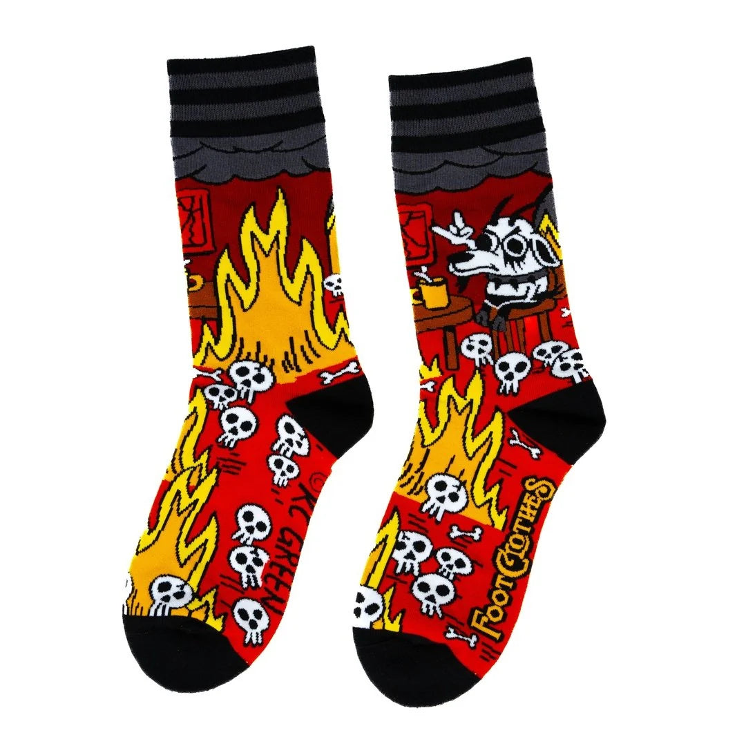 Pair of socks with flames, skulls, and text on a white background