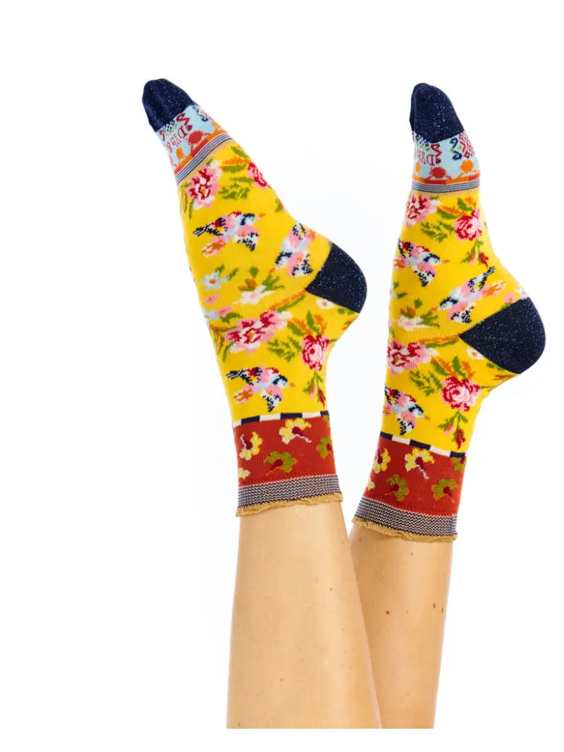 Colorful floral-patterned socks on a white background