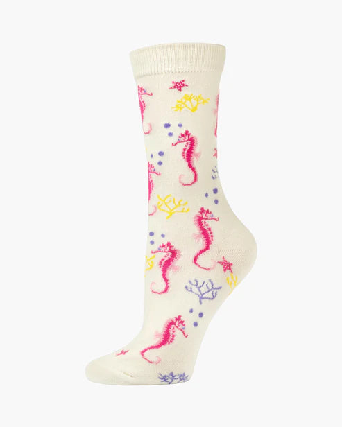 Cream-colored sock with pink seahorse and multicolor underwater-themed pattern on a white background