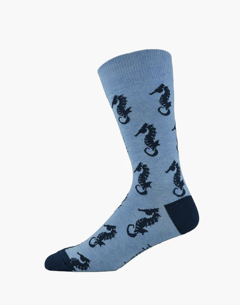 Blue sock with black seahorse pattern on a white background