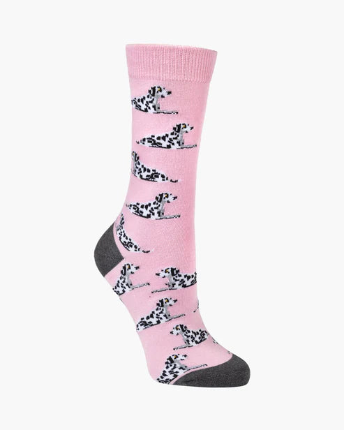 Pink sock with dalmatian dogs pattern on a white background