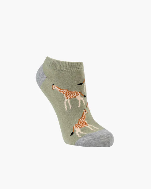 Sock with giraffe design on a light green background