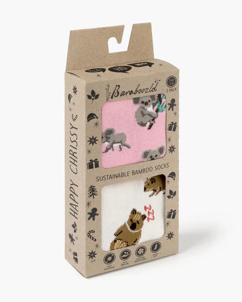 Packaged bamboo socks with animal designs on a white background