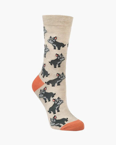 Beige sock with dog pattern and orange toes on a white background