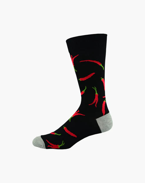 Black sock with red chili pepper pattern on a white background