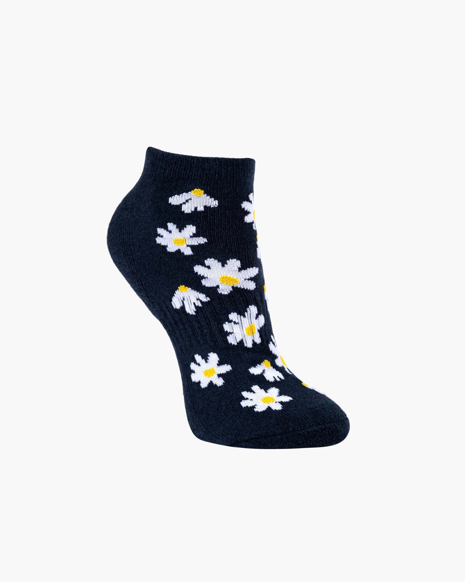 Navy blue socks with white daisy flowers on a white background