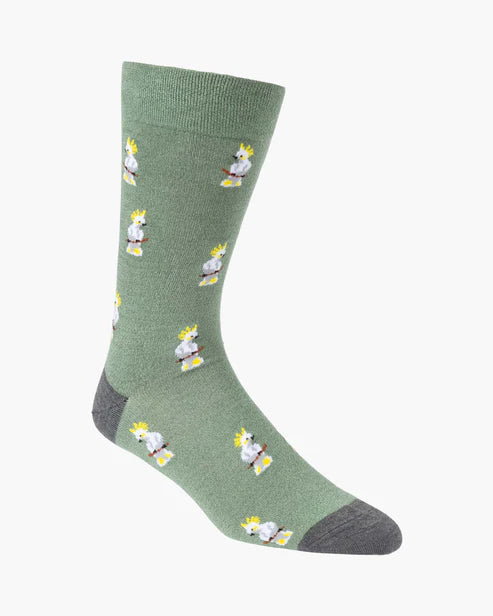 Green sock with cockatoo pattern on a white background