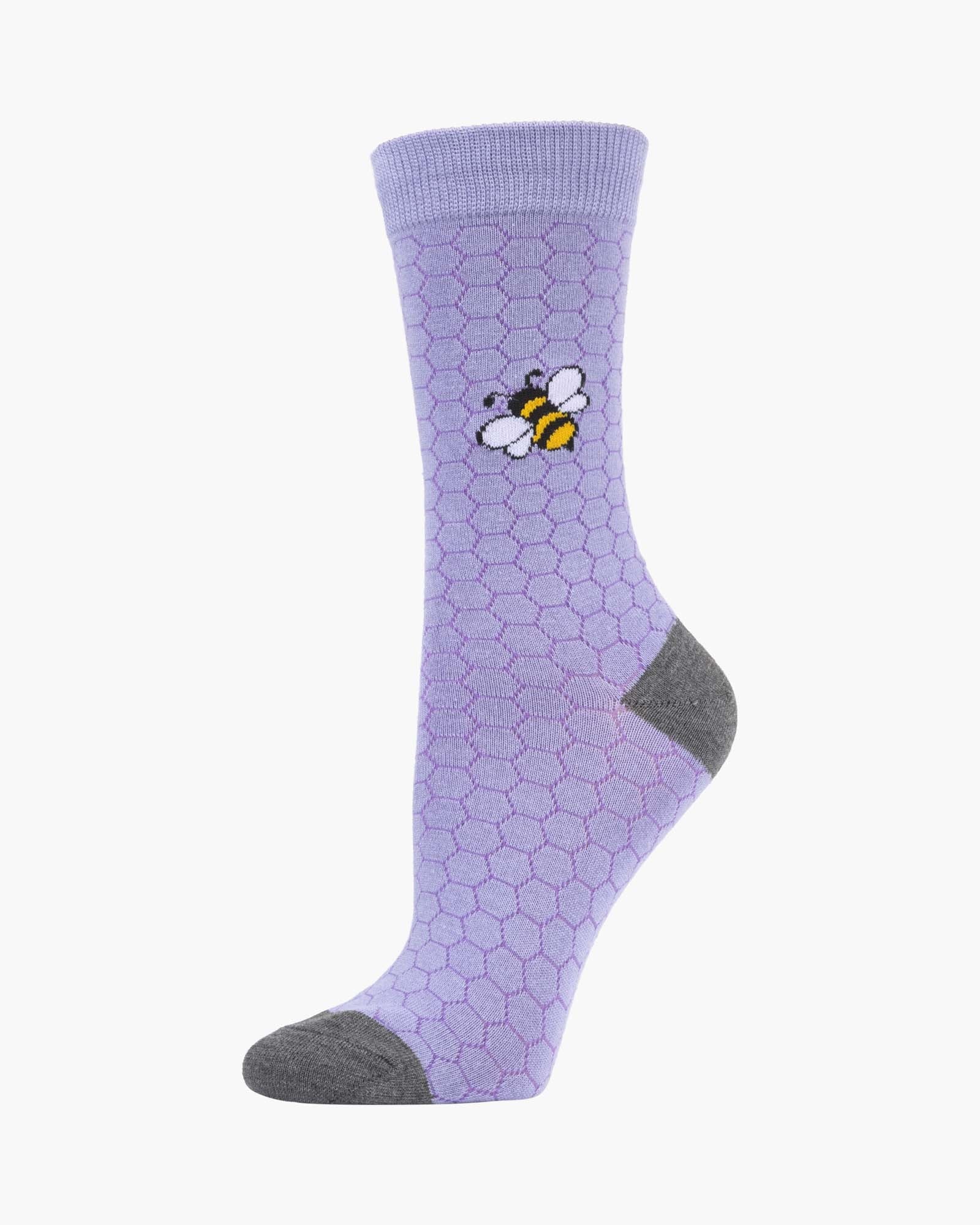 Purple sock with a bee and honeycomb pattern on a white background