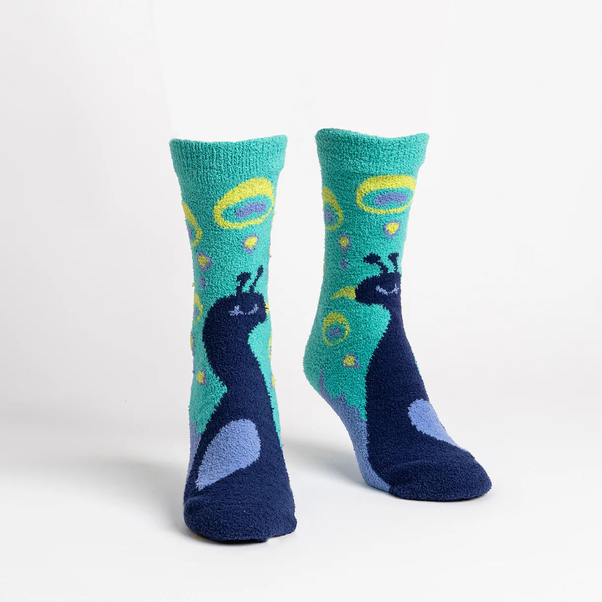 Pair of socks with peacock design on a white background