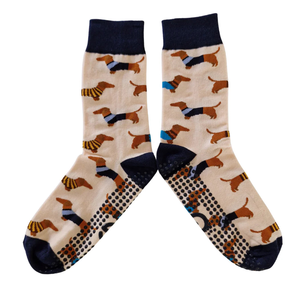 Pair of socks with dachshund pattern on a beige background