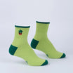 Pair of green socks with a small plant design on a light gray background