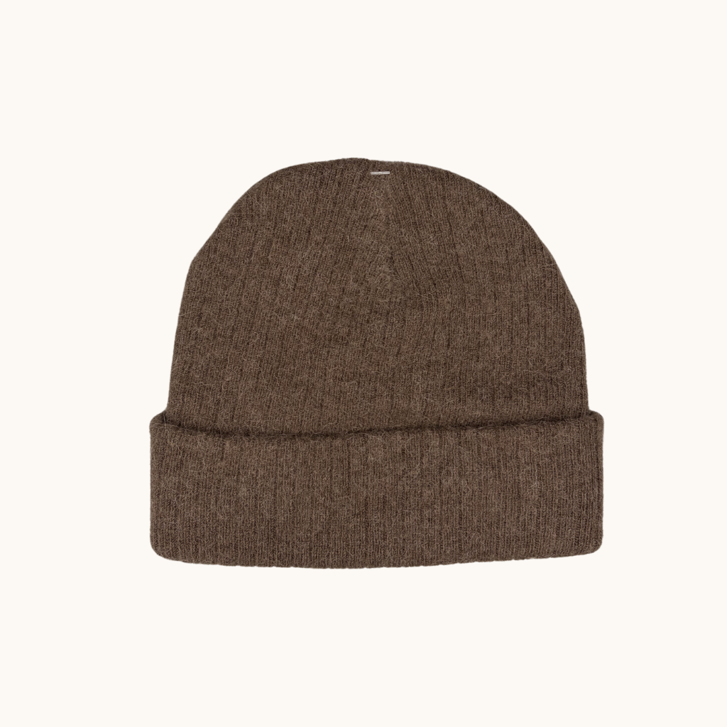 Brown knit beanie on a white background