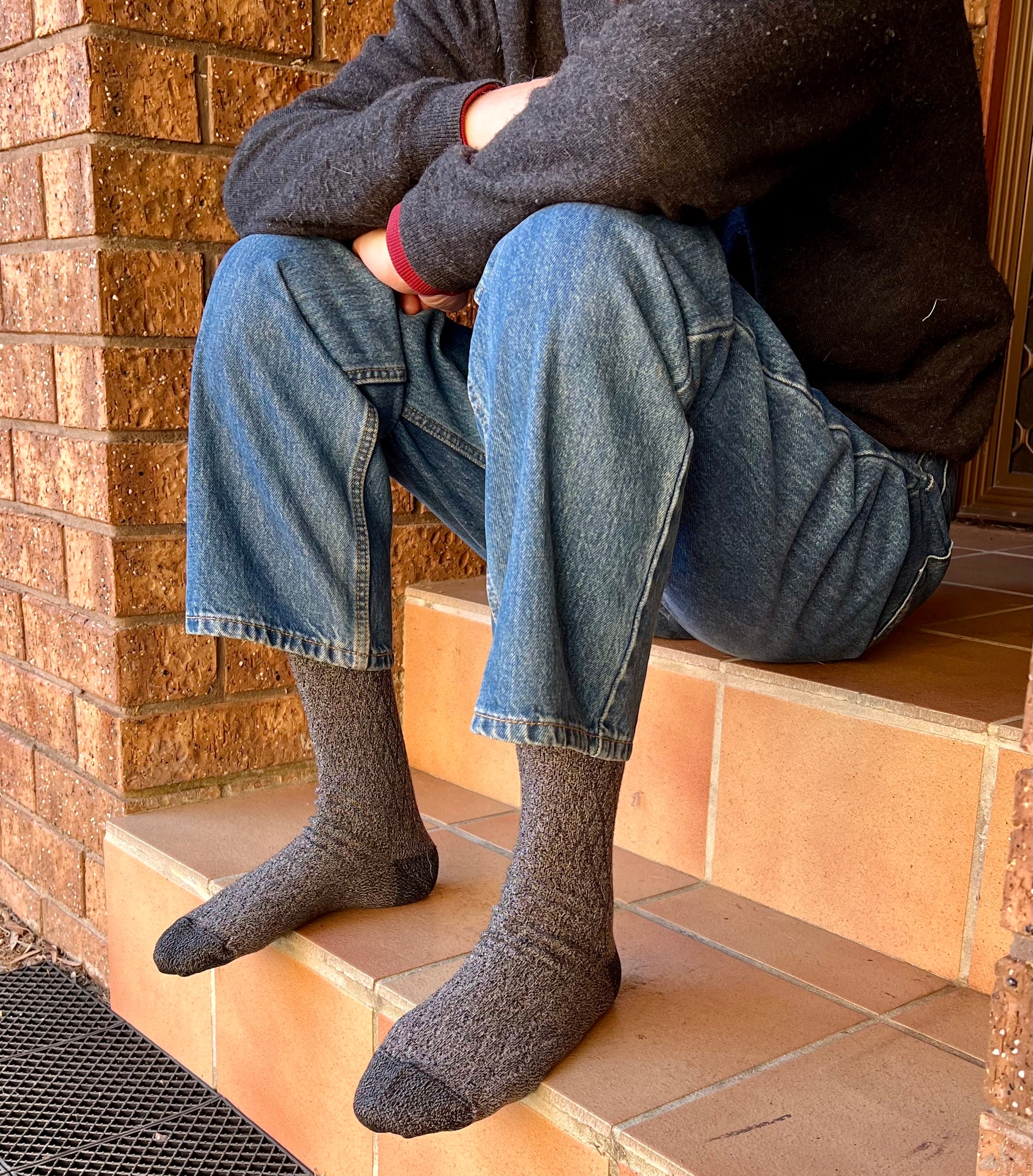person in jeans wearing wool and bamboo charcoal grey socks - The Sockery