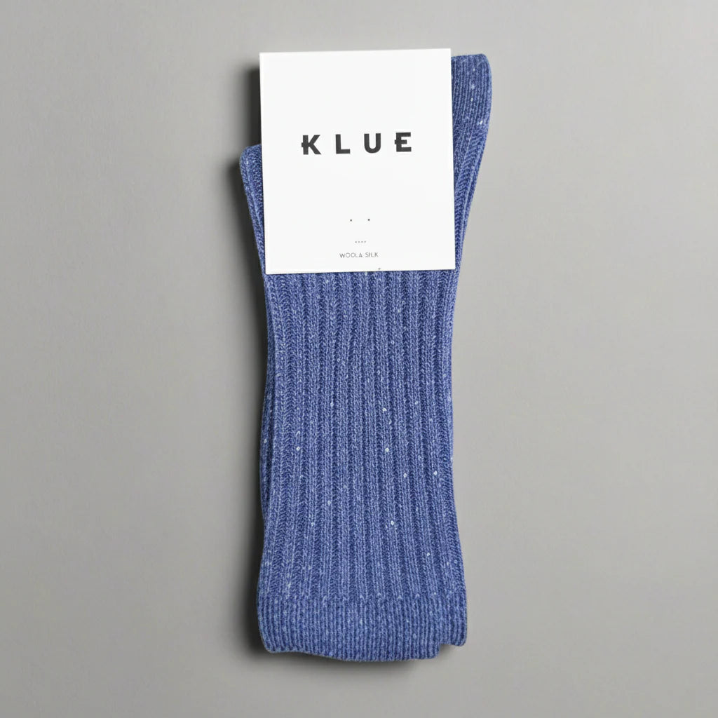 Blue sock with a KLUE label on a gray background